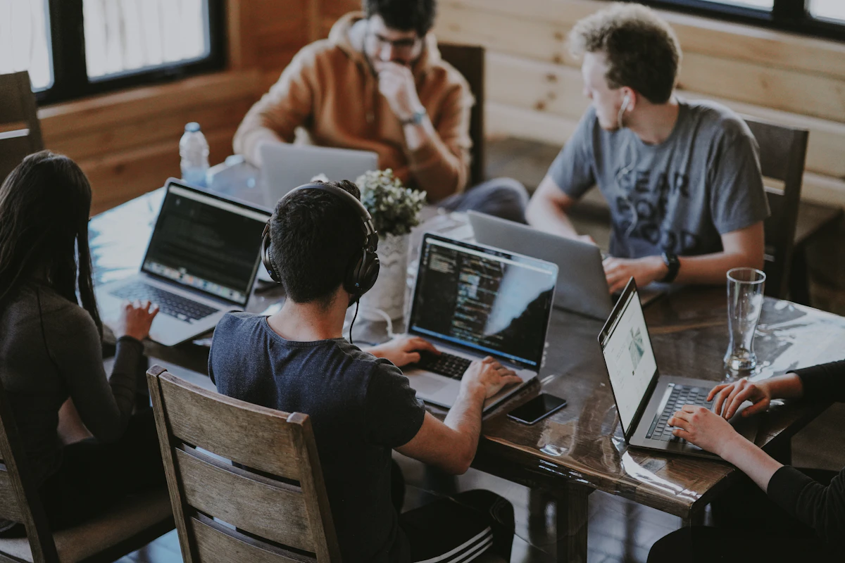 A group of colleagues reviewing work together; illustrative stock photograph